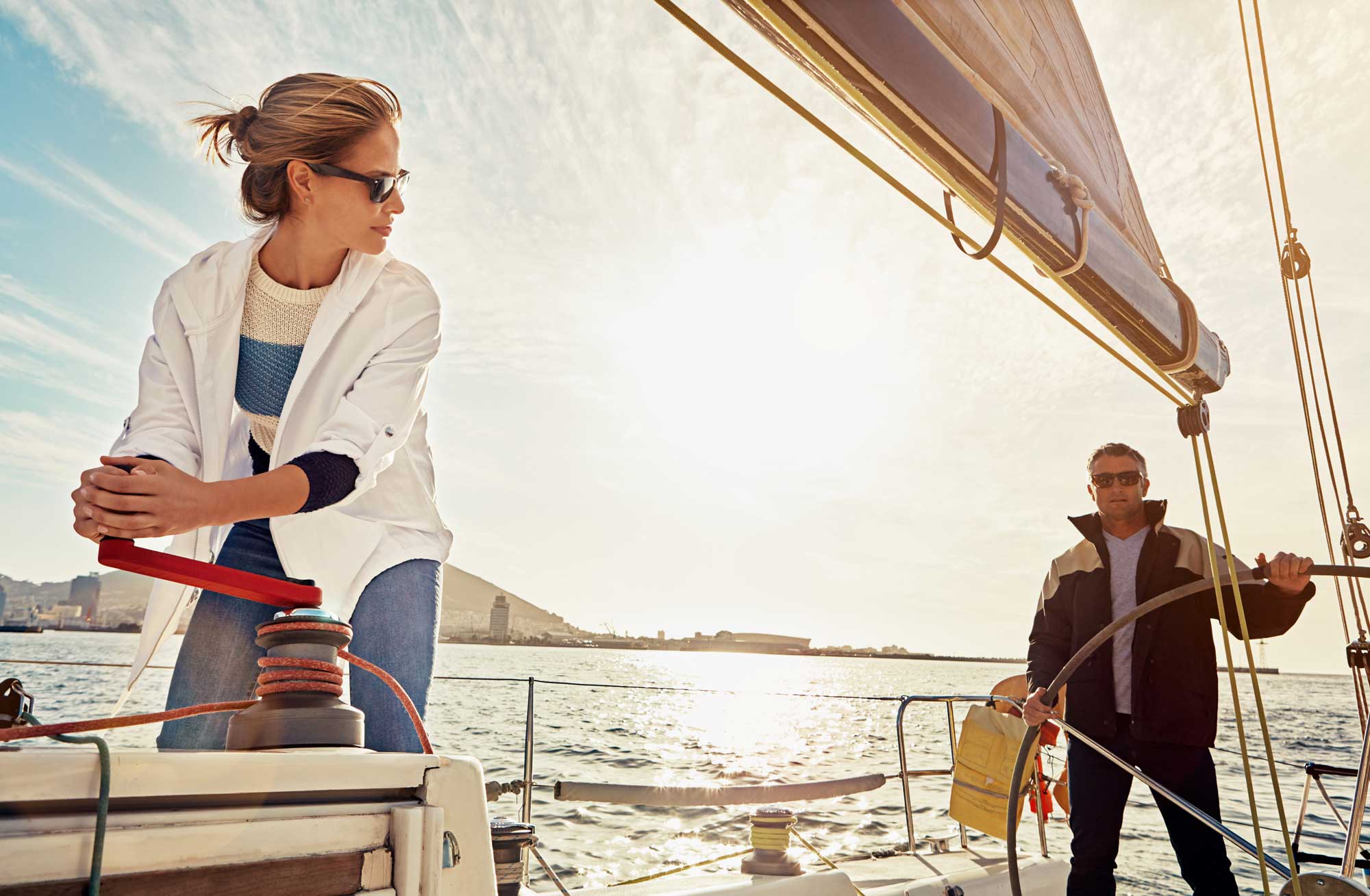 boat-couple-and-steering-wheel-for-sea-travel